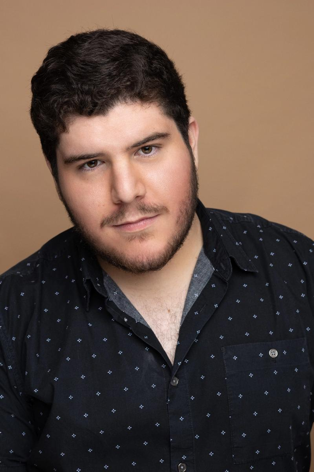 A headshot of Brendan Tomlins